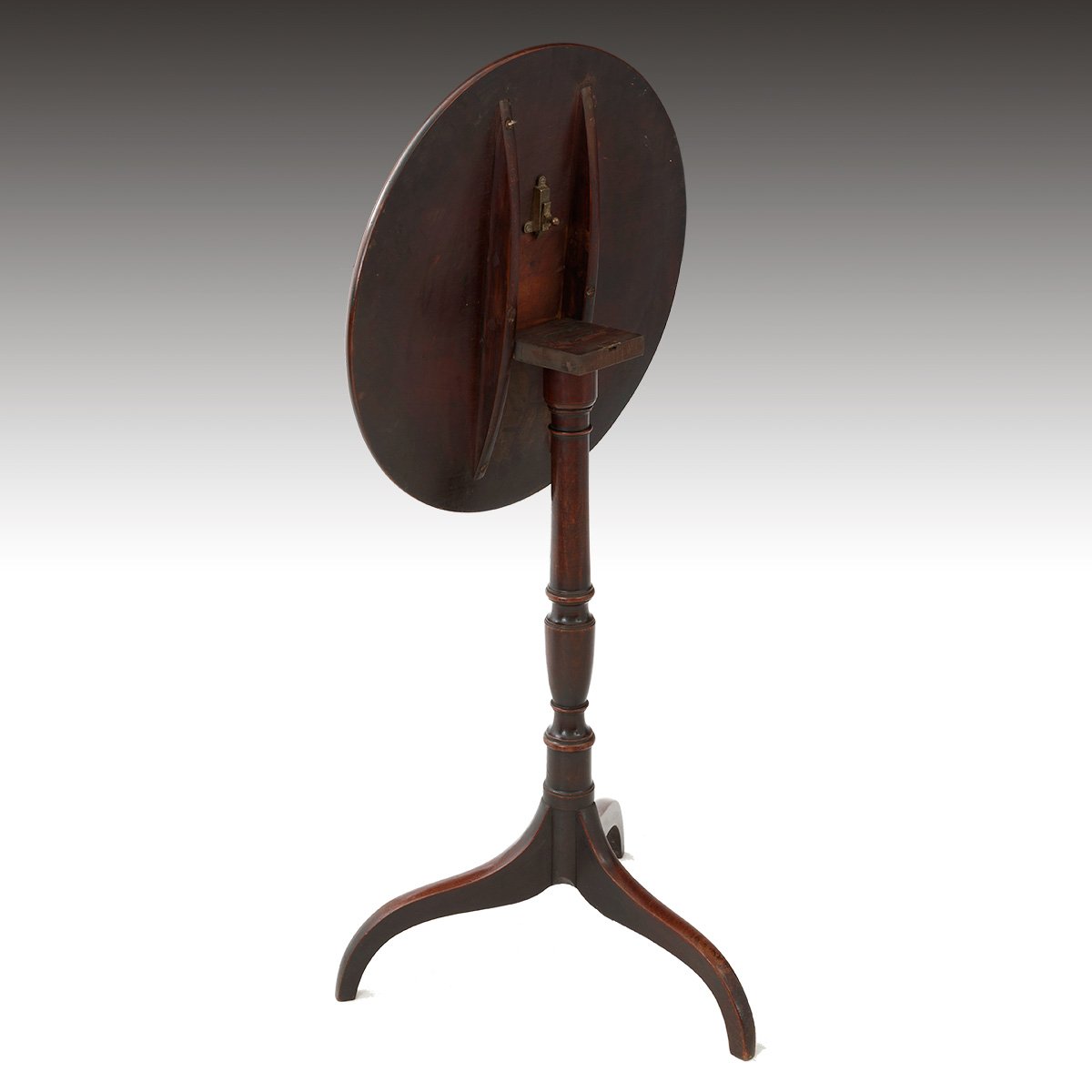 A Regency Period Mahogany Tilt Top Wine Table